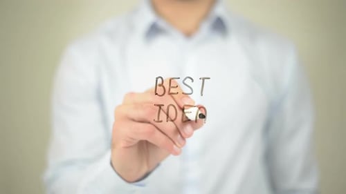 Man Writing "Best Idea" on Transparent Surface