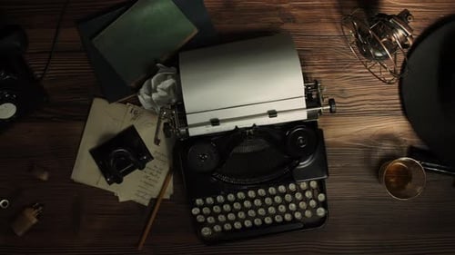 Vintage Typewriter, Phone, and Fedora on Desk