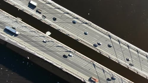 Aerial Shooting Over the Cable-stayed Bridge Over the River, Zoom in Above the Cars