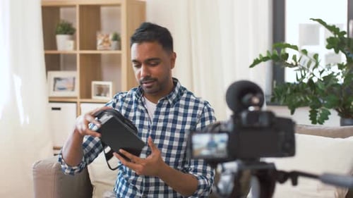 Man Reviewing Virtual Reality Headset on Camera