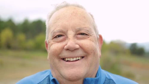 Happy Senior Man Smiling on Camera Outdoor in the Woods Elderly Healthy Lifestyle