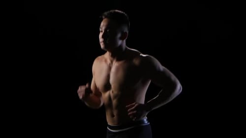 Athlete Champion Run on Black Background. Middle Distance, Side View