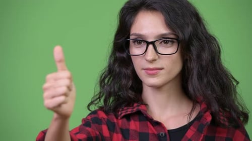 Smiling Woman Gives Thumbs Up Gesture