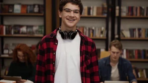 Smiling Teen Student in Library Setting