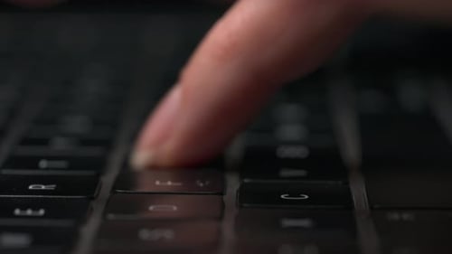Fingers Typing on Black Computer Keyboard, Close-Up