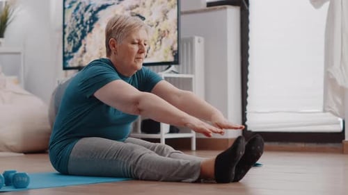 Senior Woman Stretching at Home