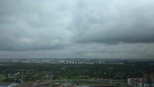 Flight over the city block in cloudy weather.