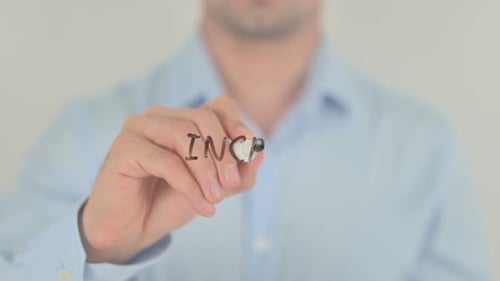 Man Writes Increase Confidence on Clear Surface