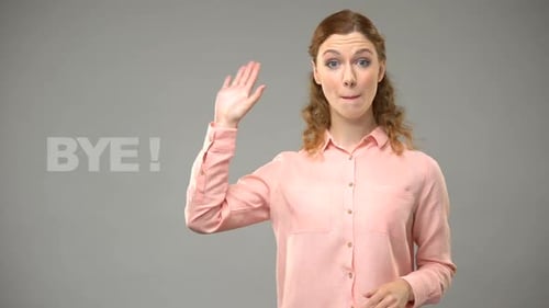 Female Saying Bye in Sign Language, Text on Background, Communication for Deaf