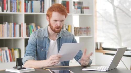 Angry Casual Redhead Man Tearing Contract Torn