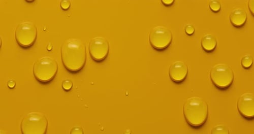 Abstract water drops on yellow background, macro, Bubbles close up