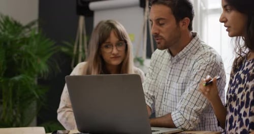 Millennial creative professionals working in a creative office