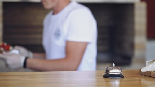 Restaurant Chef Rings Service Bell for Food