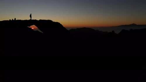 Silhouette Of People Watching Mountain Sunset