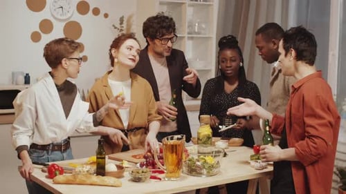 Group of Friends Prepares Food Together in Kitchen