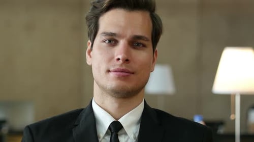 Man Opens Eyes and Looks into the Camera