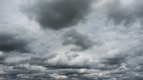 Timelapse of Fluffy Clouds Moving Across Blue Sky