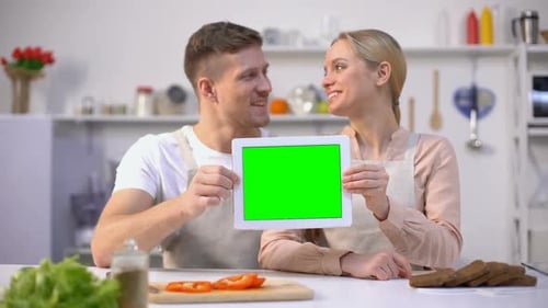 Young Smiling Couple Showing Tablet With Green Screen, Culinary Courses Template