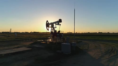 Fuel Production, Oil Pump, Pumping Oil in Field, View From Height, Sunset Light.