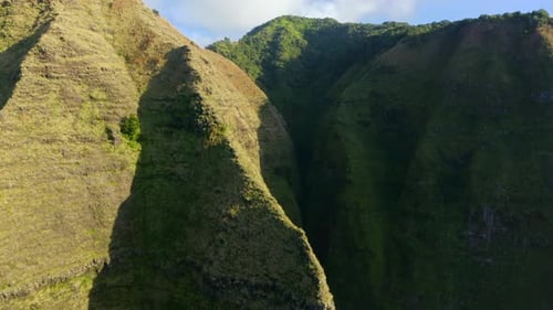 Aerial Shot Past the Slope of a Mountain, Coming To the View of a Narrow Crevice