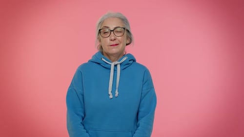 Senior Woman in Blue Sweatshirt Smiling