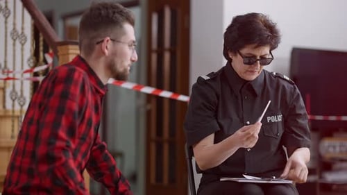 Police Interviewing Man and Showing Him Photos