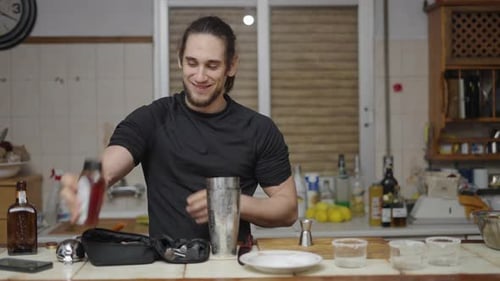 Man Preparing Cocktail at Home Bar