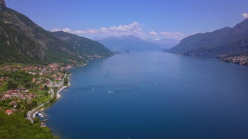 Aerial Flying Over Mountain Lake Como in North of Italy, Lot of Lakeside Villages, Sunny Weather