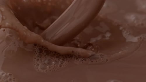 Chocolate Liquid Being Poured in Close-Up Shot