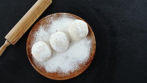 Overhead shot of Dough Balls with Rolling Pin