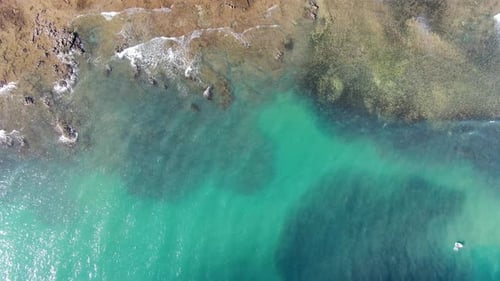 Aerial Top View of Turquoise Clear Sea Water with Coral Reef.