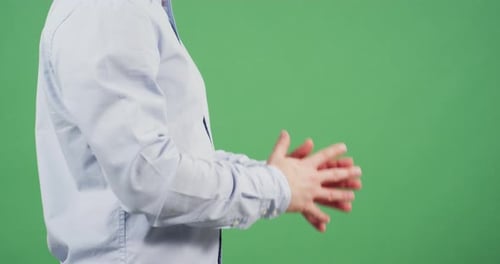 Side view of crossed fingers in prayer