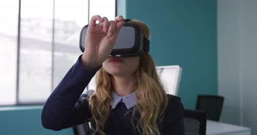 Woman Uses VR Headset in Modern Office