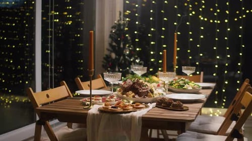Festive Christmas Dinner Table with Lights and Candles