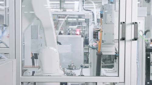 Advanced robotic machine manufacturing parts in an automated assembly line