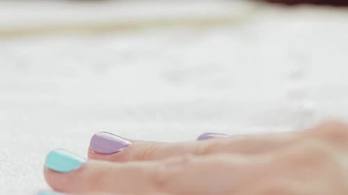 Young Woman Paints Her Nails with Natural Gel Base. Nails Manicure.