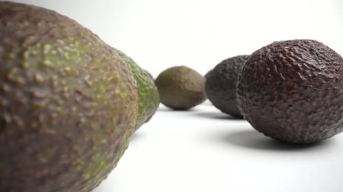 Fresh Avocados Displayed on White Background