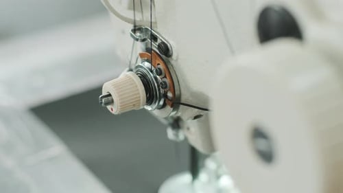 Closeup of sewing machine working part with leather. Cnc sewing machine