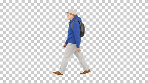 Young boy wearing a backpack walking to school, Alpha Channel