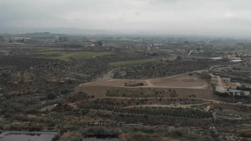 Camera flight over biogas plant near pig farm in rapeseed fields