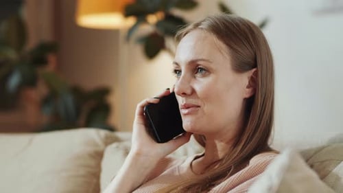 Smiling Woman Talking on Phone at Home