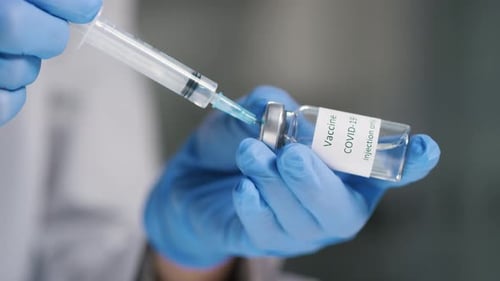 Drawing Vaccine from Vial with Syringe and Needle