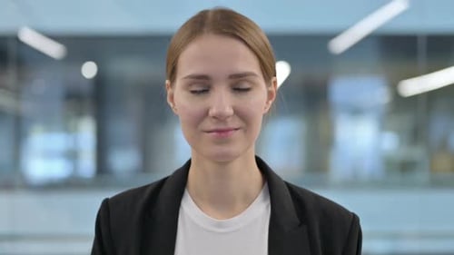 Young Woman Smiling in an Office Setting