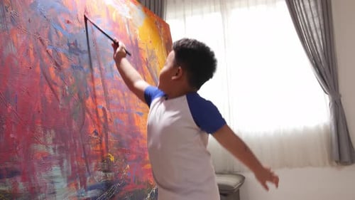 Child Painting Abstract Art on Canvas at Home