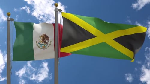 Mexico and Jamaica National Flags Waving Against Blue Sky