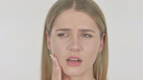 Face of Young Woman having Toothache on White Background