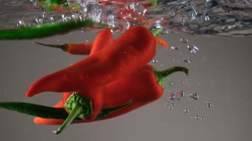 Chili Peppers Falling in Water