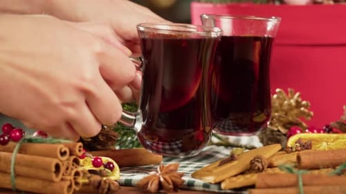 Festive Mulled Wine with Spices and Holiday Decorations