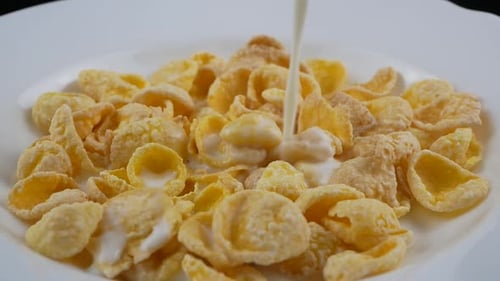 Milk Poured on Cornflakes for Breakfast