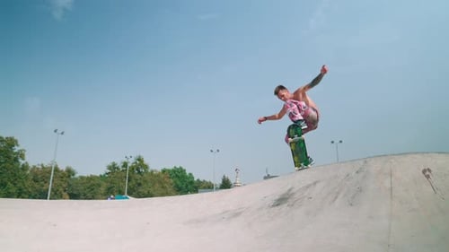 Male Performing Skateboard Trick in Urban Skate Park